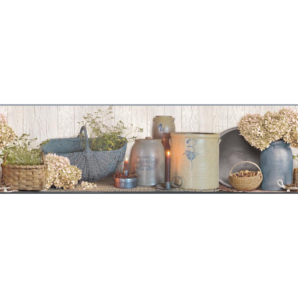 Tall slender porcelain bottle with natural clay textured body and cork stopper.